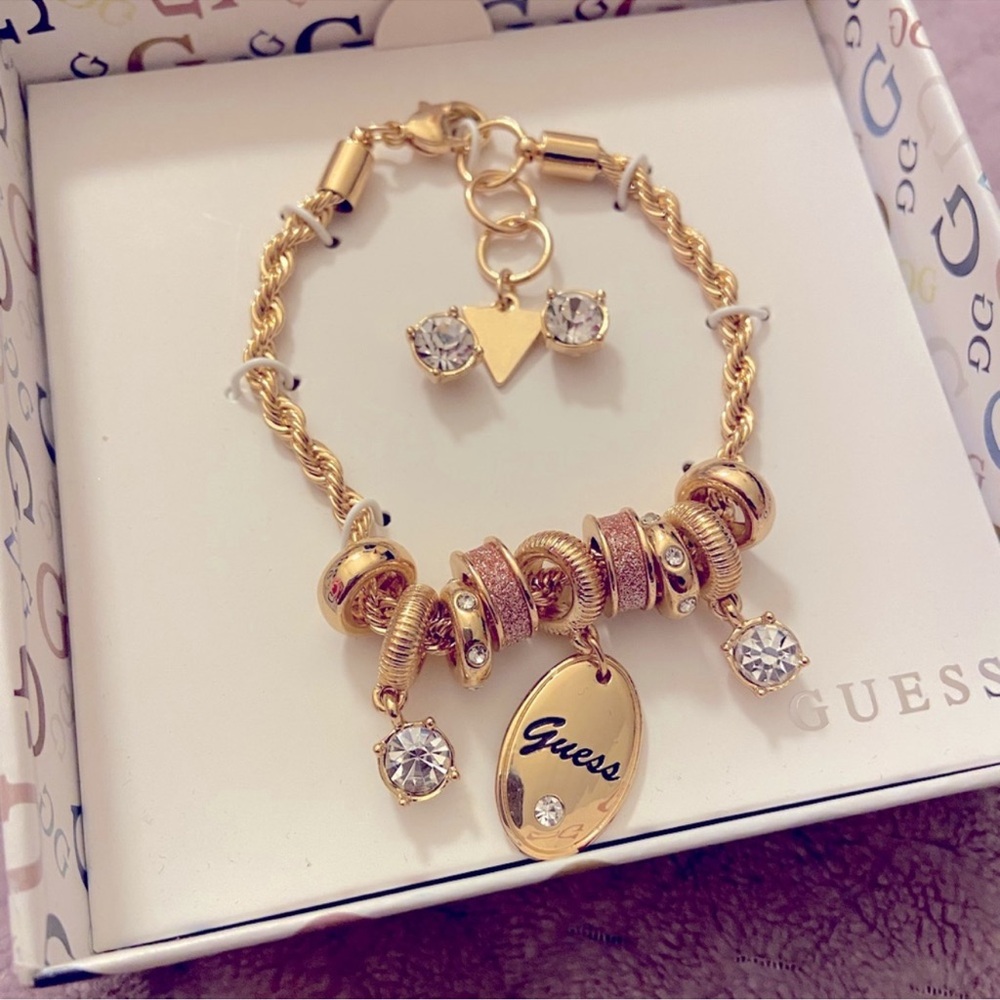 Guess charm bracelet and earrings